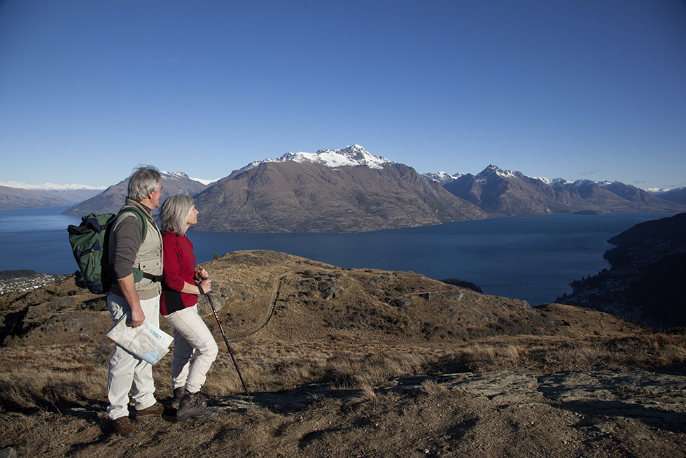 Couple on trail viewing mountains
