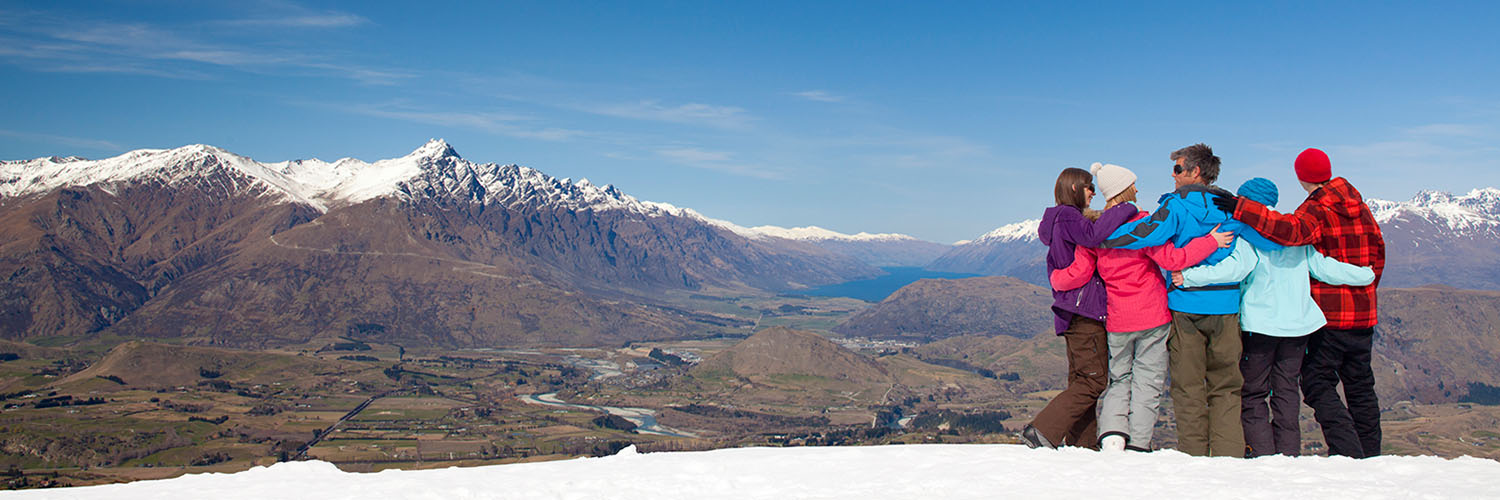 Group hugging on cliffside